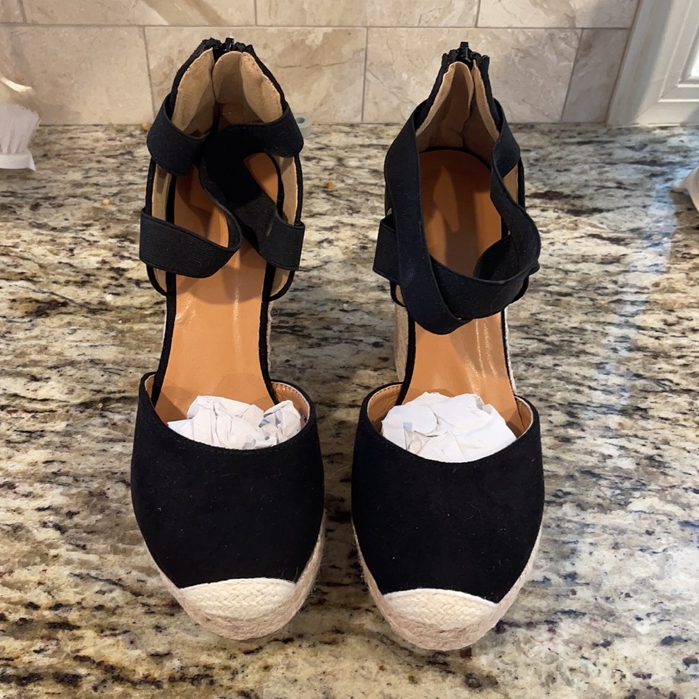 Brand new pair of black platforms